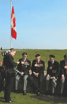 a newspaper reporter talking to veterans